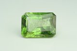 Big faceted Peridot w. Ludwigite inclusions